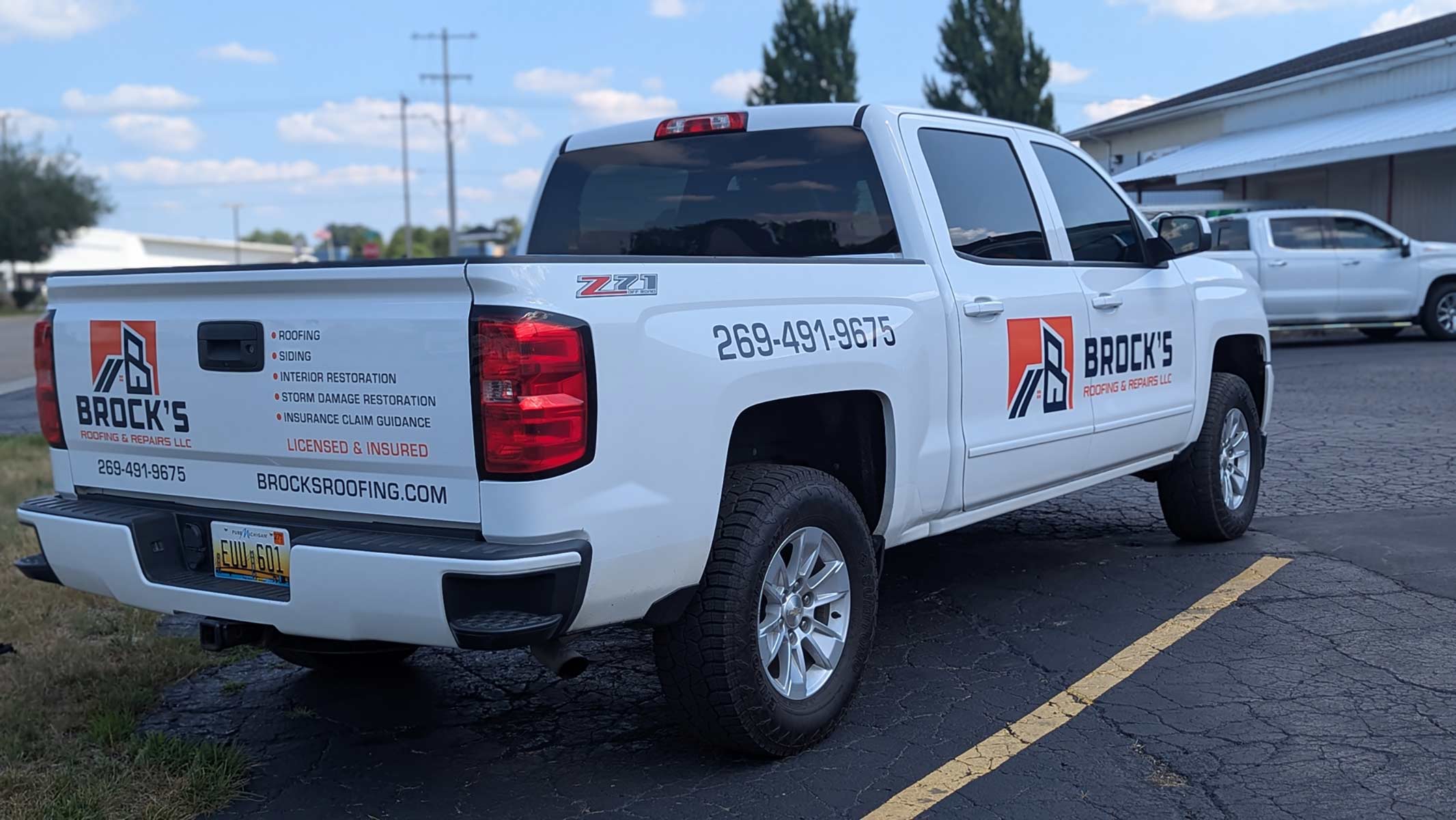 Brocks Roofing truck back quarter view